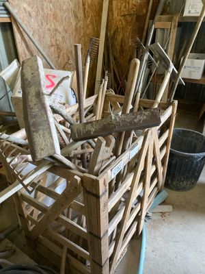 a wooden crate with tools in it in a garage