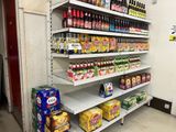 many different types of beverages on the shelves in the store