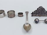 a lot of silver items that are on a table