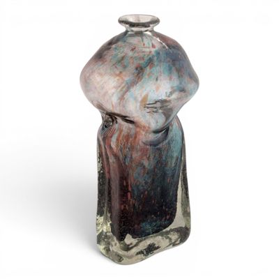 an image of a glass bottle with a face on it