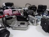 a lot of cameras that are sitting on a table