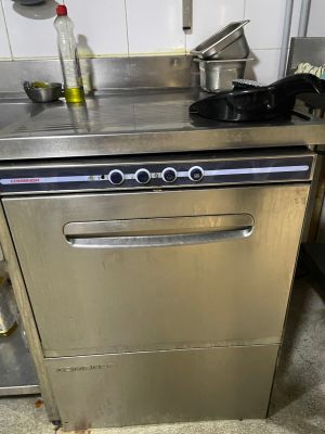a stainless steel dishwasher in the middle of a kitchen