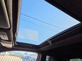 a view of the sunroof from inside a car
