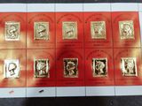 a red and gold stamp with a picture of a woman on it