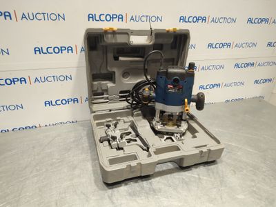 a close up of a tool box with a drill on top of it