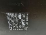 the back of a laptop with a battery attached to it