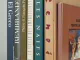 three books that are stacked on top of each other
