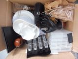 a box full of assorted items including a knife, fork and spoon