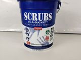 a bucket of scrubs sitting on top of a counter