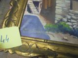 une photo d'un tableau posé sur une table, avec un mot accroché dessus