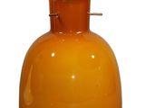 orange glass vase with a yellow top on a white background