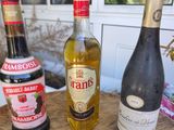 three bottles of wine sitting on a table next to each other