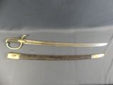 pair of antique brass - plated swords on display at a museum