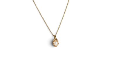a gold necklace with a small white stone on a gold chain