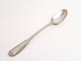 silver spoon on a white surface with a white background