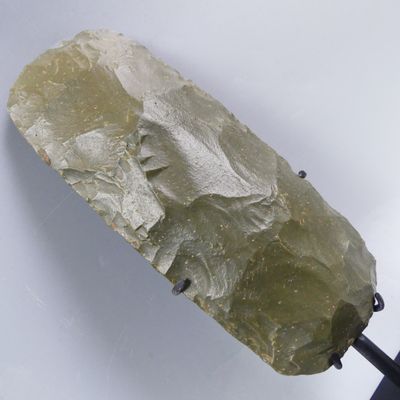 a rock that is sitting on top of a black stand