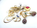 a pile of jewelry that is sitting on a table