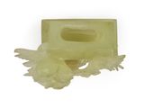 yellow soap bar with flowers on it on a white background
