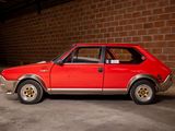 a red car that is parked in a garage
