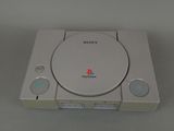 the sony playstation classic console is sitting on a table