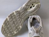 the sole of a pair of white shoes on a white background