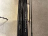 two fishing rods and a fishing rod are sitting on the floor