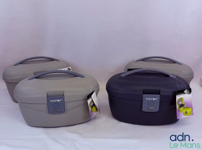 three suitcases sitting next to each other on a white surface