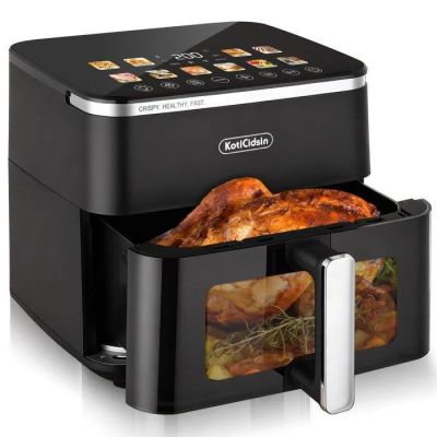 a close up of an air fryer with chicken in it