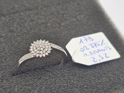 a diamond ring with a price tag attached to it