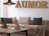a living room with a couch, coffee table, and lamp