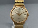 an image of a gold wrist watch on a clear stand