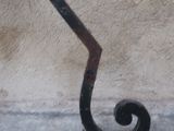 a wrought iron stair rail on the side of a building