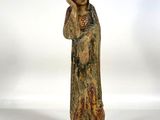 an image of a statue of a woman holding a baby