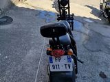 a motorcycle that is parked on the side of the road