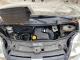 the engine of a car with its hood open and the hood open