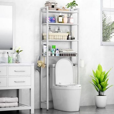 a white toilet sitting next to a white cabinet in a bathroom