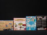 a lot of nintendo wii games on the table