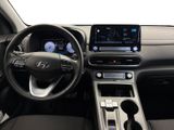 the interior of a car with a steering wheel, dashboard, and dashboard controls