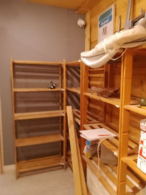 a room that has a shelf with a lot of items on it