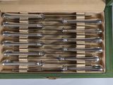 a box with a bunch of knives and spoons inside of it