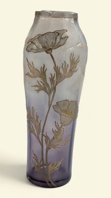 a glass vase with a floral design on it