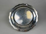 a silver plate that is sitting on a table
