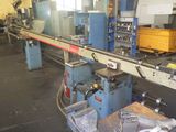 a picture of a machine that is working on a piece of metal