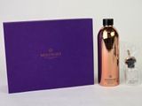 the bottle is next to a purple box with a black lid