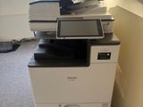 a printer that is sitting on top of a cabinet