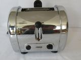 a toaster that is sitting on a white surface