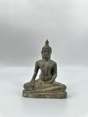 Statuette de Bouddha en bronze, la divinité assise en padmas…