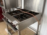 a stove that has two burners on it in a kitchen