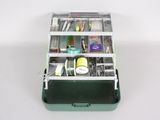 a green box with many different items inside of it