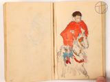 someone is holding a book with a drawing of a man on a horse